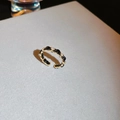 Detail of gold woven chain ring with black enamel inlay and sparkling rhinestones - No. 15 Open Rings - Gold