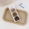 Close-up of three matte brown hair claws in a tray, highlighting geometric design - 3Pcs Claw Clip Set-Square Shape / Coffee Brown Series