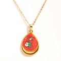 Close-up of gold water drop pendant featuring festive Christmas tree and snowman patterns - Red Teardrop Christmas Elements (Style 3)
