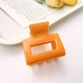 Fashionable bright orange rectangular hollow hair claw clip for women's hairstyling - Orange Red