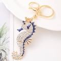 Detail of golden seahorse keychain with clear crystals and deep blue enamel accents - Seahorse 2 (Blue)