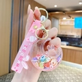 Pink moon-shaped liquid keychain with a cute bunny figurine and ice cream wrist strap - Quicksand Shell - Star Moon Rabbit