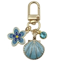 Exquisiter goldener Schlüsselanhänger mit blauer Emaille-Muschel und Kristall-Anhänger - See-Blau Ozean Muschel Blau Diamant Blume