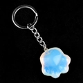 Translucent milky white agate cat paw keychain with a silver metal ring on black background - Opalite (Synthetic)