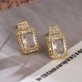 Elegant gold plated square zircon stud earrings featuring luxury pave setting gemstones - White Zirconia