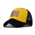 Close-up of the breathable mesh back and American flag patch on the yellow trucker hat - Black & Yellow
