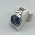 Men's silver chronograph watch with blue dial displayed on white leather pillow - Off-White Bead Velvet Watch Pillow