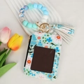 Floral card wallet detail with silicone beaded wristlet and elegant white tassel hook - Sky Blue Floral