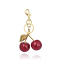 Sparkling red cherry keychain with gold-tone hardware and leaf charm on white background - Bright Red/Gold Buckle