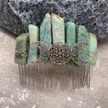 Macro detail of handmade natural crystal hair comb with silver crescent moon on mossy rock - Amazonite Silver Wire Silver Moon