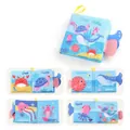 Libro de tela océano para bebés con colas de animales 3D para juego sensorial - Animales del Océano / 4 Páginas 8 Caras (23g)