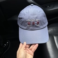 Detail of embroidered letters on a purple washed cotton baseball cap held in hand - L (58-61cm) / Navy Blue