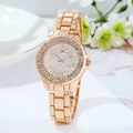 Detailed view of a rose gold women's watch with sparkling rhinestone accents. - Rose Gold