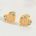Macro shot of heart-shaped floral earrings with enamel finish and cubic zirconia - Lake Blue (ES2607)