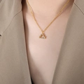 Golden Libra zodiac pendant necklace with sparkling crystals worn by a female model - Libra - Gold / 40+5cm