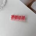 Close-up of pink translucent gummy bear hair clip with four matte resin bears in a row - Pink
