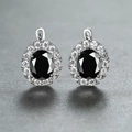 Elegant silver earrings with oval black gemstones and sparkling white zircon halo - Platinum Plated Black Zirconia