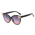 Elegant cat-eye sunglasses with pearl flower decor and gradient lenses on white background - Black Frame Grey Pink Lens