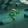 Bague ouverte dorée élégante avec motif floral vert sur fond texturé foncé - Ouvert Réglable / Or-Vert