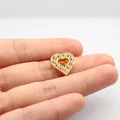 Close-up of heart-shaped gold pendant with sparkling rhinestones for DIY jewelry - 10MM Gold Rhinestone-Heart