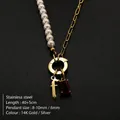 Stainless steel necklace with imitation pearls, red stone and letter f pendant detail - Gothic Letter F