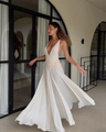 Elegant white deep V-neck maxi dress featuring intricate lace hollow waist and flowing skirt - S / White