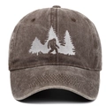Close-up of high-density Bigfoot and pine trees embroidery on washed cotton baseball cap - Coffee