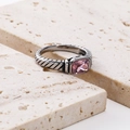 Macro shot of silver cable texture ring featuring a bezel-set pink rectangular gemstone - Silver Pink Zirconia