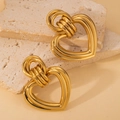 Vintage gold-plated stainless steel heart-shaped earrings on a textured stone background - Retro Gold Heart Style (E0730)