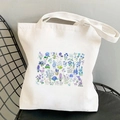 Off-white canvas tote bag featuring vibrant blue and purple floral cosmos prints - Blue and Purple Wildflowers