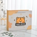 Süße gelbe Papiertüte mit Tiger-Motiv und Tragegriffen für Kindergeburtstage - Süßer Kleiner Tiger