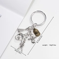 Detailed view of metal baseball keychain charms showing glove, bat and heart pendant - Baseball Type 2