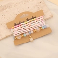 Detail of bohemian multilayer beaded bracelet with colorful seed beads on marble surface - Colorful