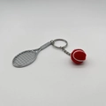 Mini silver tennis racket keychain with red and white felt ball on white background - 4.8cm*3.8cm / Metal Tennis Keychain Red