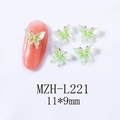 Macro detail of 11x9mm green butterfly resin nail art charm with glitter finish - Light Green Gradient Butterfly (L221)