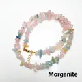 Macro detail of natural irregular morganite chips necklace with gold lobster clasp closure - Morganite