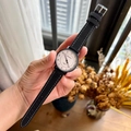 Quartz wristwatch with white dial, black casing, and black suede strap with stitching - Black