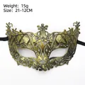 Vintage black and gold half-face masquerade mask with antique finish and cutout patterns - Fox Gold
