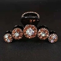 Black hair claw clip with amber and iridescent crystal flowers for women's updos - AB Champagne