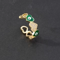 Macro shot of gold adjustable open ring featuring green enamel evil eye heart and zircons - Style 8-Green Heart Eye