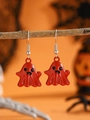 Macro view of red ghost earrings hanging on a branch for Halloween celebration - Red