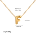 Macro view of golden bubble letter F pendant necklace with 50cm chain and size measurements - Letter F