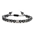 Close-up of stainless steel beads and engraved metal spacers on adjustable bracelet - Hematite