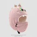Close-up of pink dinosaur winter hat featuring soft white sherpa lining and corduroy fabric - Pink