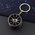 Creative black metal car wheel hub keychain with a ten-spoke design and sturdy ring - 37mm Black Wheel Rim