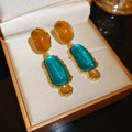 Detail view of vintage irregular resin earrings with amber and blue gems in gold setting - Silver Pin-Yellow-Blue