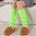 Neon green cable knit leg warmers paired with cozy brown plush slippers for home - One Size / Neon Yellow