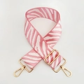 Detail of pink zebra print wide replacement shoulder strap with gold metal lobster clasps - Pink White