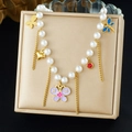 Close-up of pearl bead necklace with gold chain tassels and enamel butterfly pendants - Purple Butterfly Dragonfly Style (N3825)
