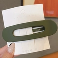 Olive green matte hair clip with hollow design displayed on a white product card - Dark Green